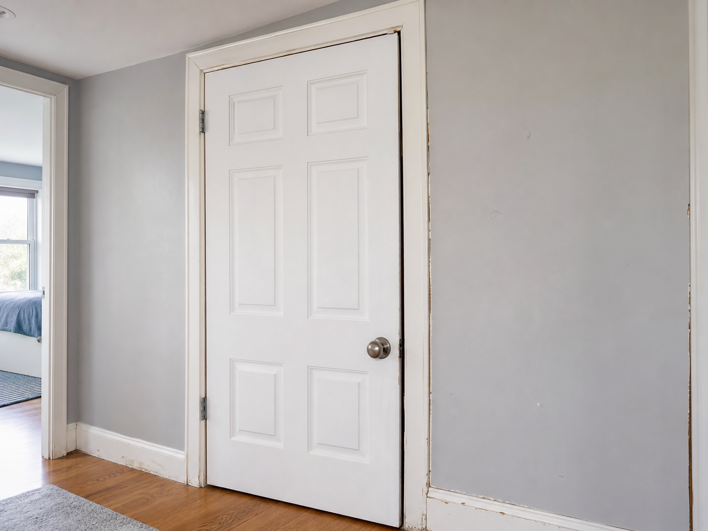 Misaligned interior door and worn trim before adjustment